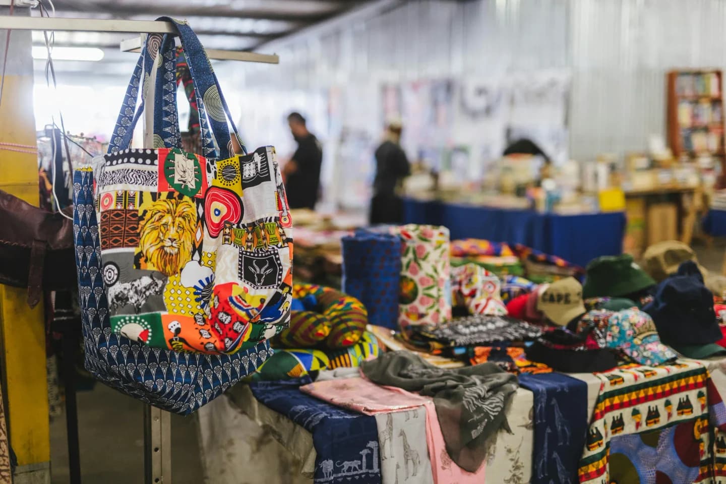 Local artisan merchant and buyer exchanging goods at community market